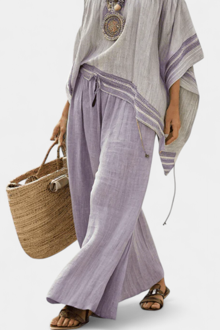 Serenella - blusa con spalle scoperte e pantaloni a gamba larga a righe