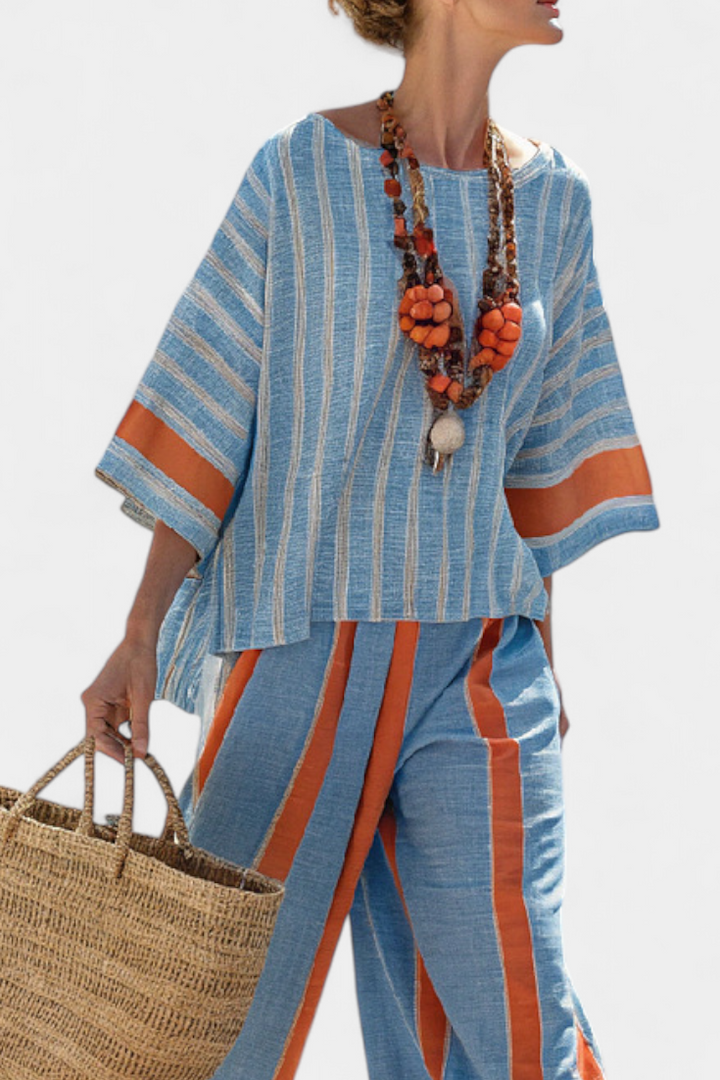 Valeria – top rigato terracotta sofisticato e pantaloni di lino