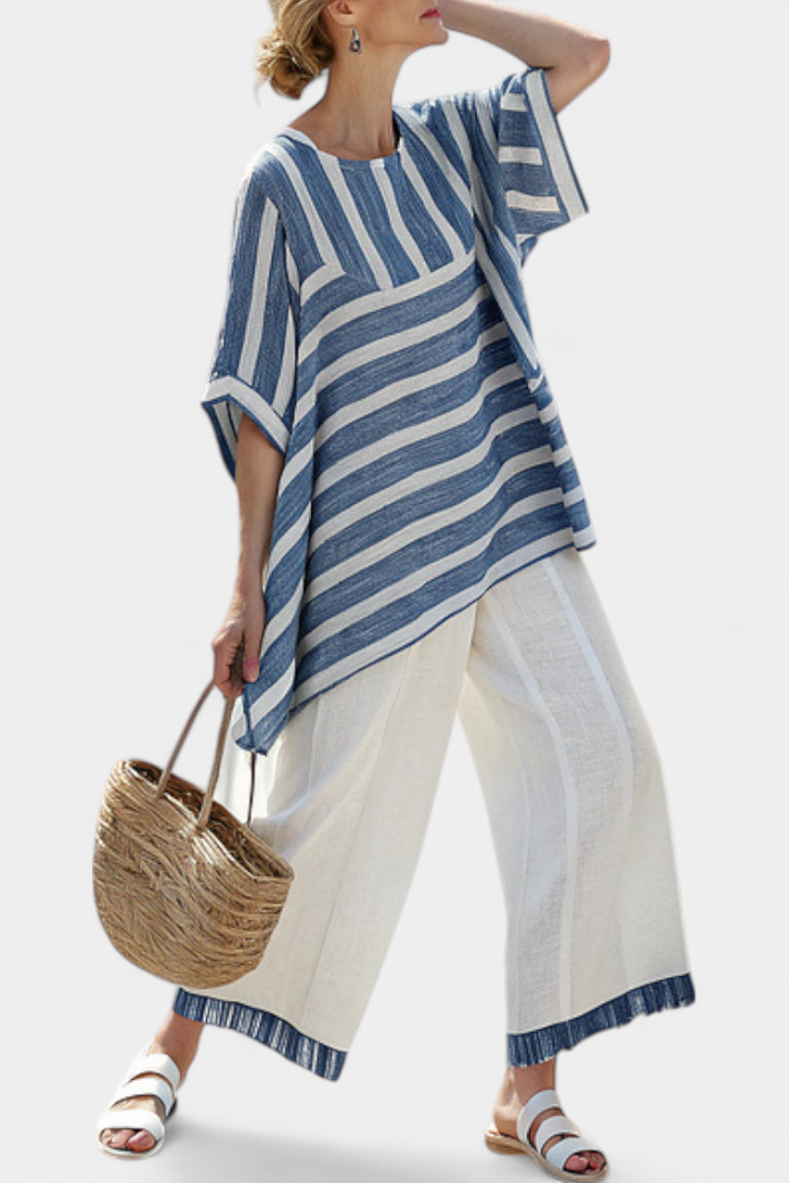Ornella – top blu sofisticato a righe e pantaloni con dettagli sul fondo