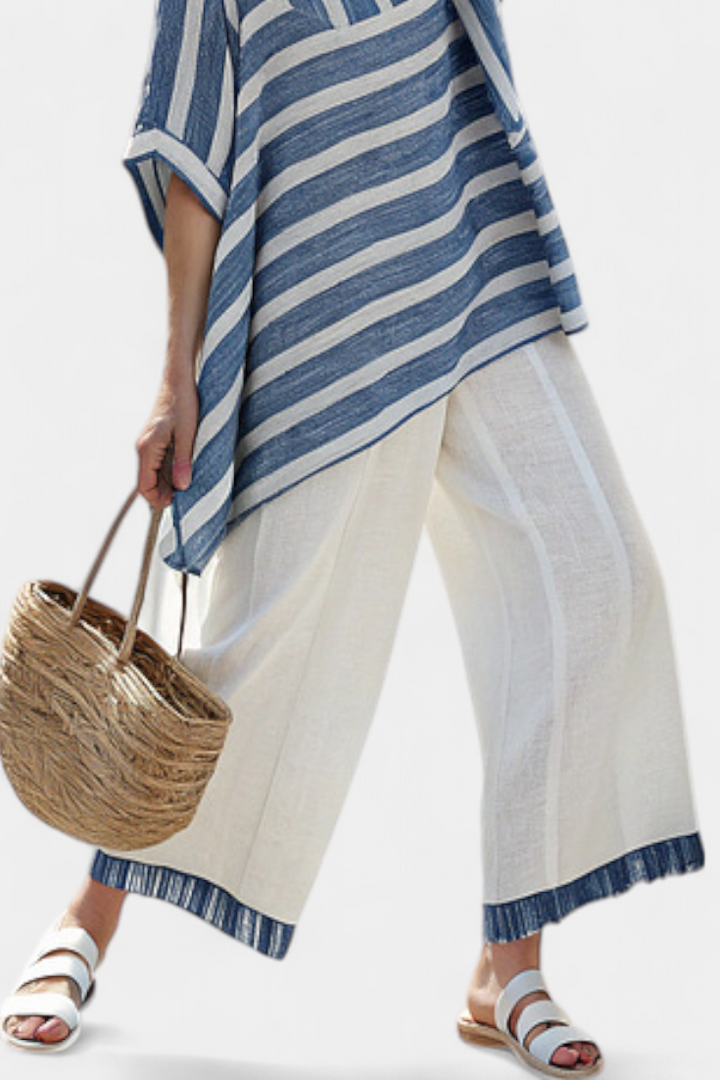 Ornella – top blu sofisticato a righe e pantaloni con dettagli sul fondo